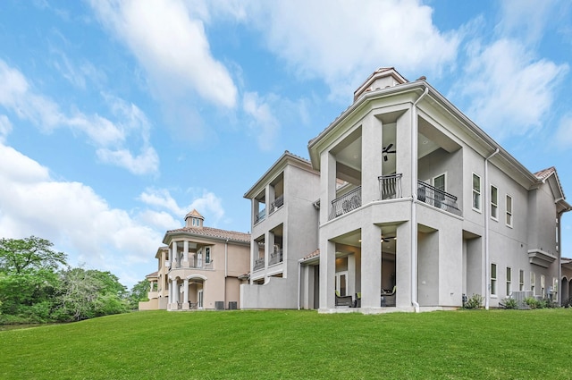 exterior space with a yard and a balcony