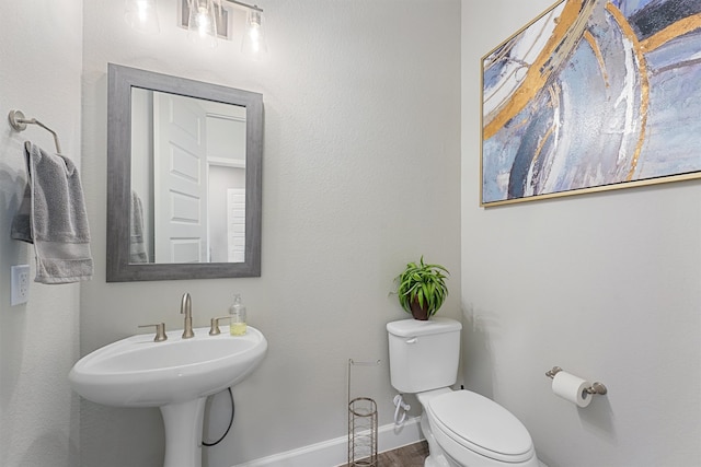 bathroom with sink and toilet