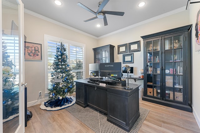 home office with light hardwood / wood-style floors, ceiling fan, and ornamental molding