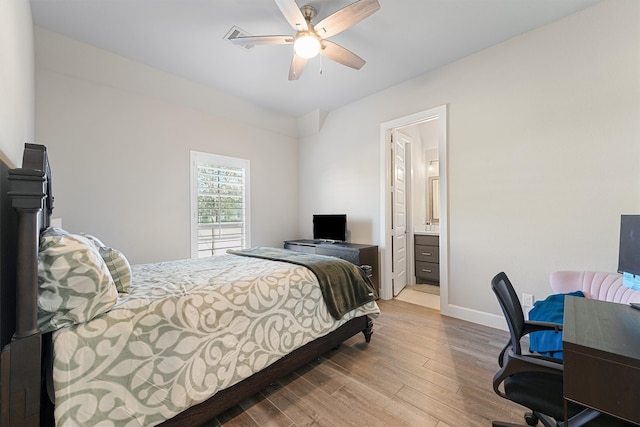 bedroom featuring wood-type flooring, ensuite bath, and ceiling fan