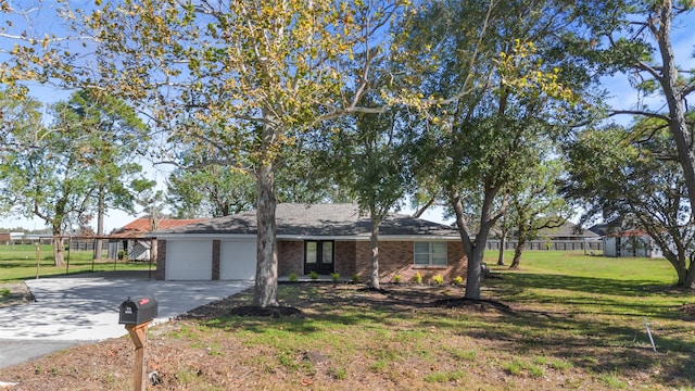 ranch-style house with a carport, a garage, and a front yard