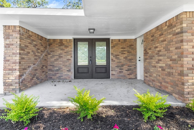 view of exterior entry featuring french doors