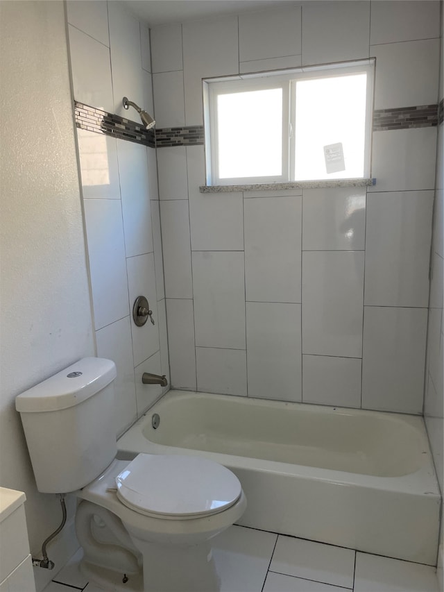 full bathroom with tile patterned flooring, vanity, toilet, and tiled shower / bath