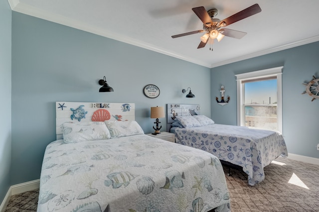 carpeted bedroom featuring ceiling fan and ornamental molding