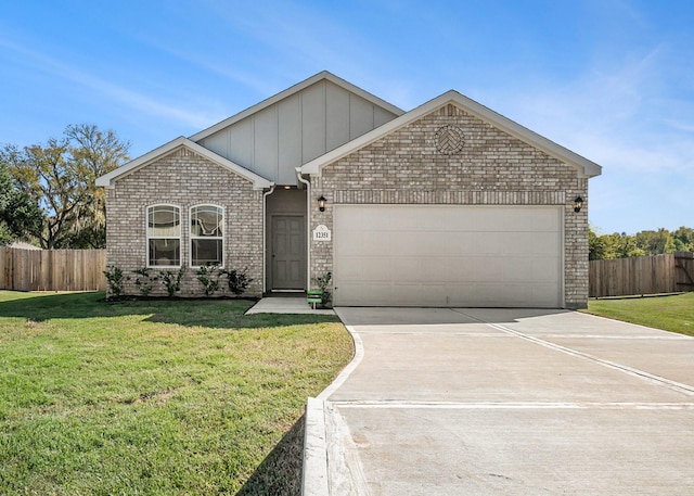 view of front of home with a garage and a front lawn