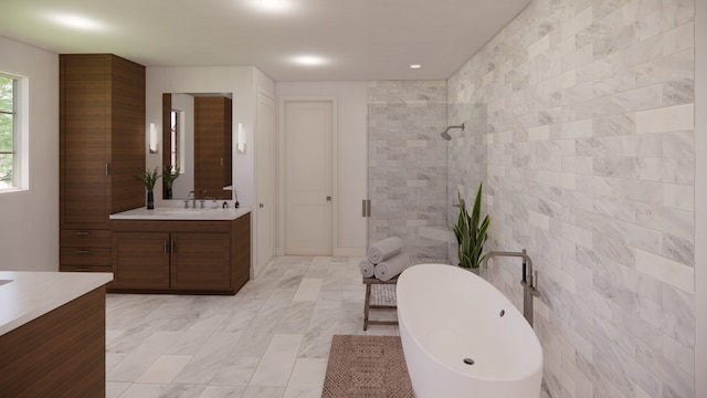 bathroom featuring independent shower and bath, vanity, and tile walls