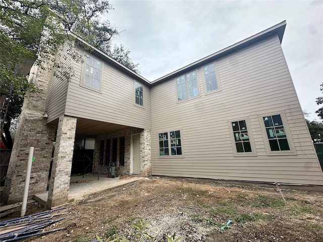 rear view of house featuring a patio