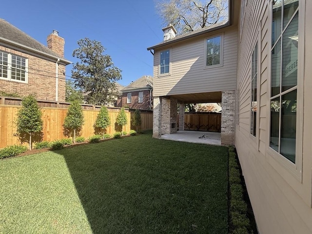 view of yard featuring a fenced backyard and a patio area