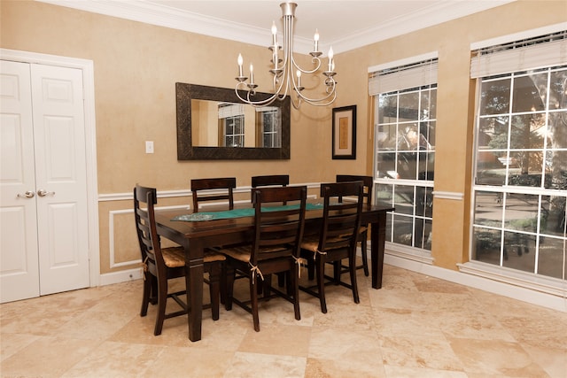 dining room featuring a chandelier and ornamental molding