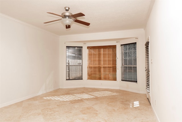 spare room featuring crown molding, ceiling fan, and a textured ceiling