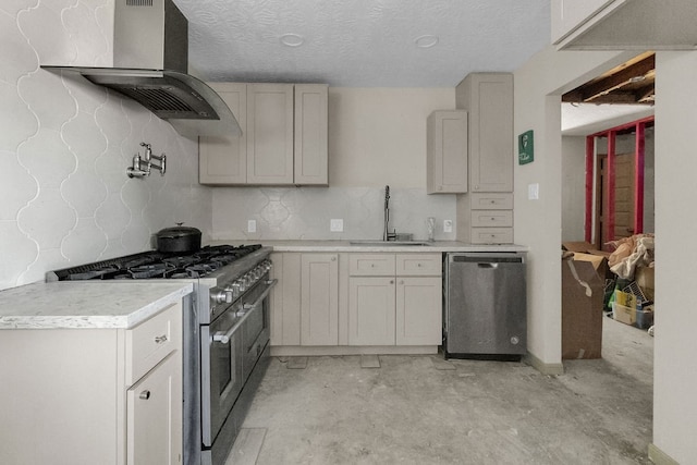 kitchen with decorative backsplash, appliances with stainless steel finishes, a textured ceiling, extractor fan, and sink