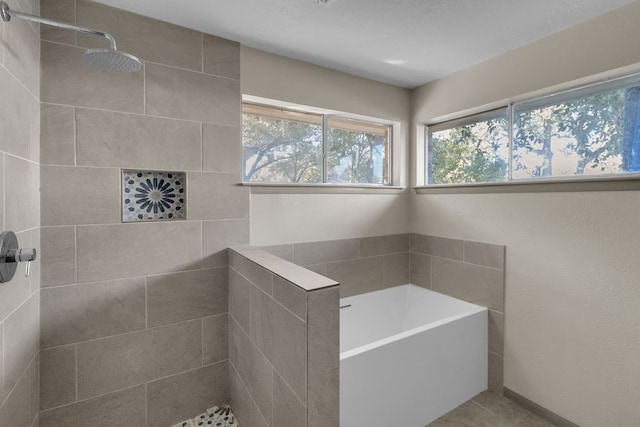 bathroom featuring separate shower and tub