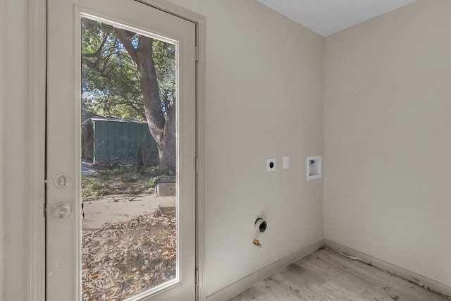 laundry area with washer hookup, light hardwood / wood-style floors, and hookup for an electric dryer