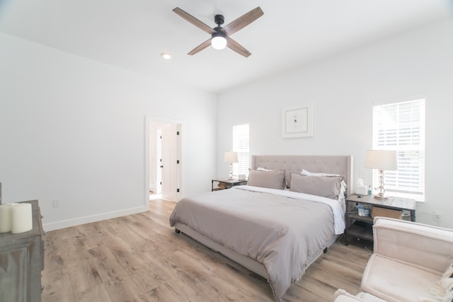 bedroom featuring light hardwood / wood-style floors and ceiling fan