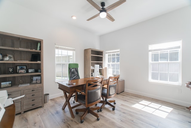 office area with ceiling fan and light hardwood / wood-style flooring