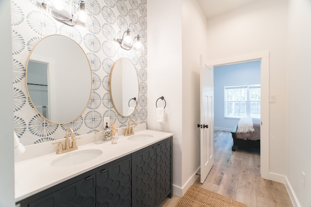 bathroom with hardwood / wood-style floors and vanity