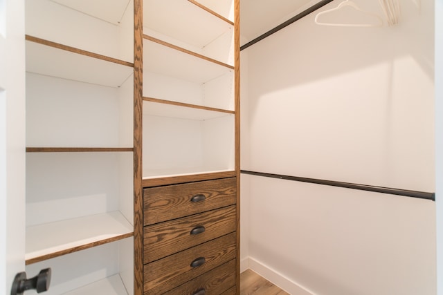 spacious closet featuring hardwood / wood-style floors