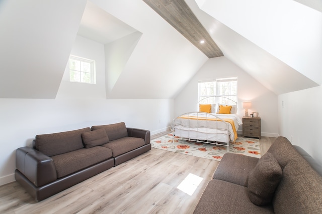 bedroom featuring vaulted ceiling and light hardwood / wood-style flooring