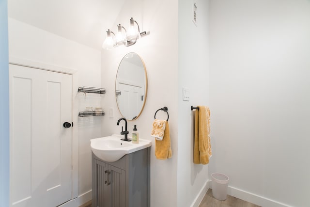 bathroom featuring vanity and wood-type flooring