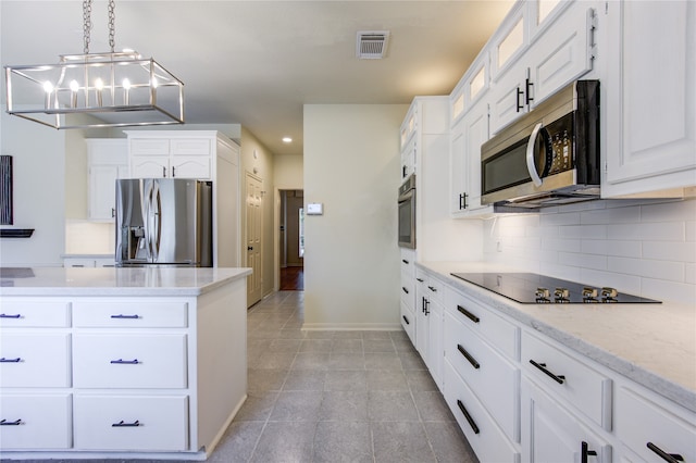 kitchen featuring white cabinetry, stainless steel appliances, pendant lighting, decorative backsplash, and light tile patterned floors