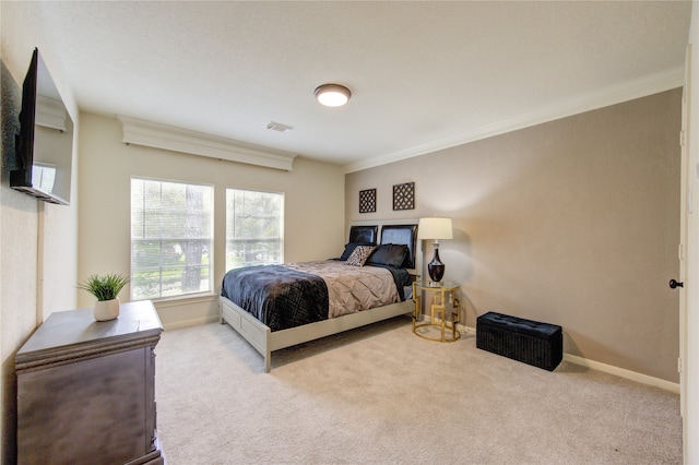 bedroom featuring light carpet and ornamental molding