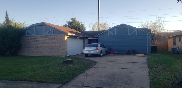 view of front of home featuring a front lawn and central air condition unit