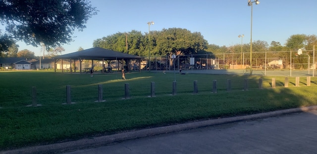 surrounding community with a gazebo and a lawn