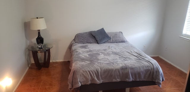 bedroom featuring dark tile patterned floors