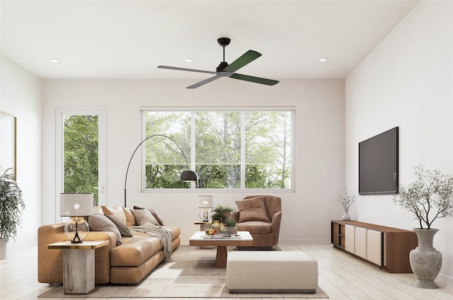 living room with light wood-type flooring and ceiling fan