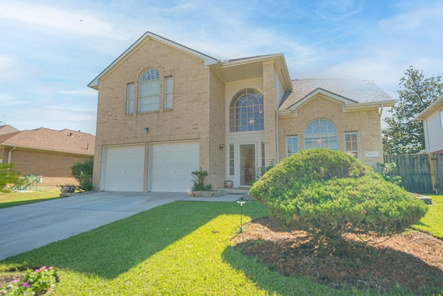 front of property with a garage and a front lawn