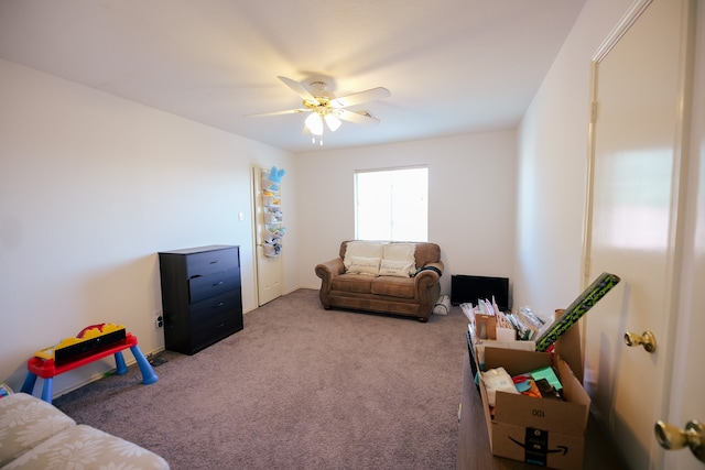 living room featuring light carpet and ceiling fan