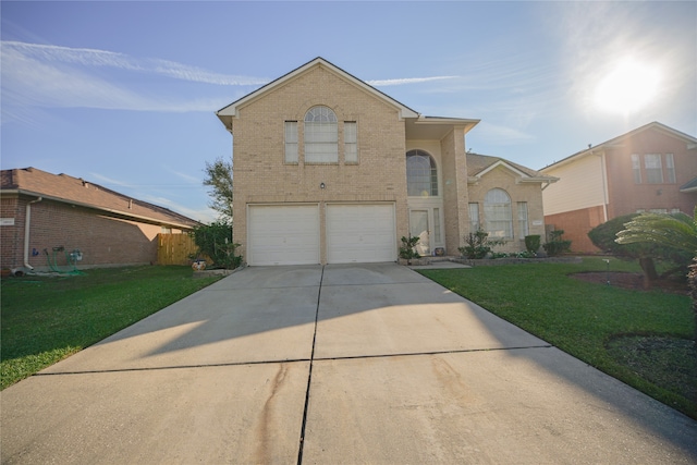 front facade with a front yard and a garage