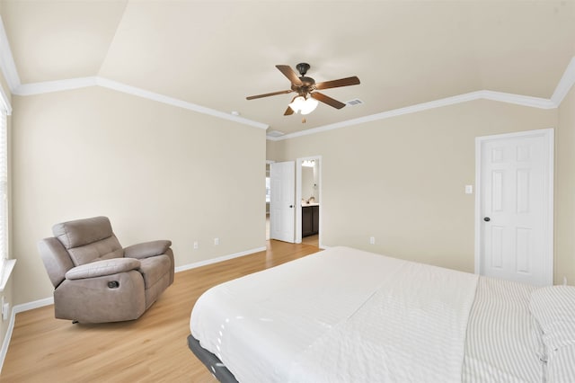 bedroom featuring hardwood / wood-style floors, ceiling fan, crown molding, and vaulted ceiling