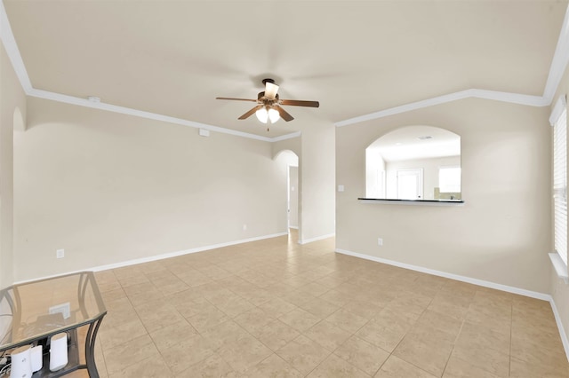 tiled spare room featuring ceiling fan and crown molding