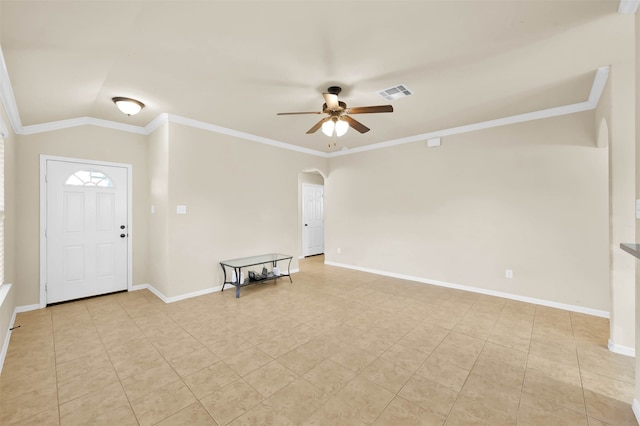 foyer with crown molding, ceiling fan, and lofted ceiling