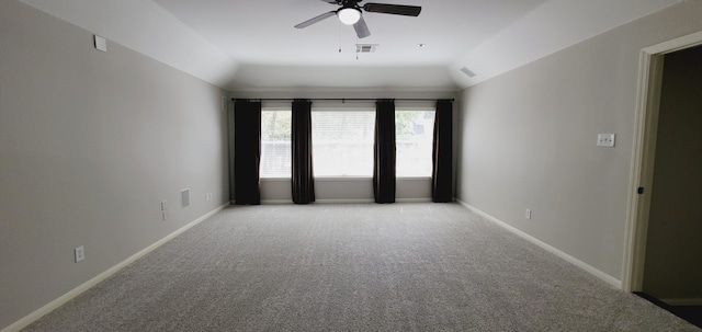 carpeted empty room with ceiling fan and lofted ceiling