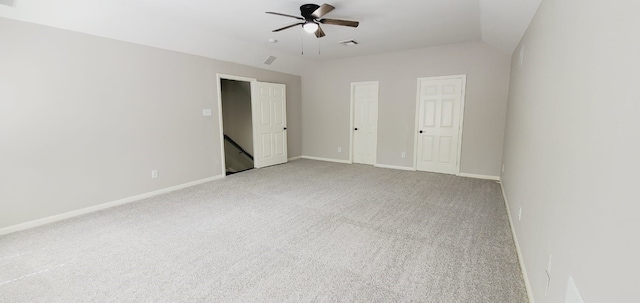 empty room with ceiling fan and carpet floors