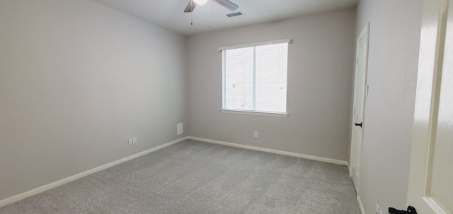 unfurnished room featuring light colored carpet and ceiling fan