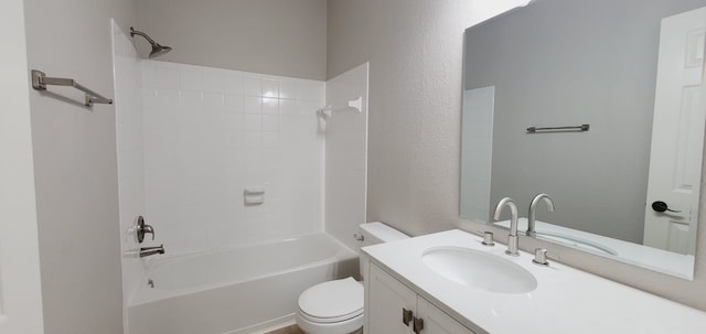 full bathroom featuring toilet, vanity, and washtub / shower combination