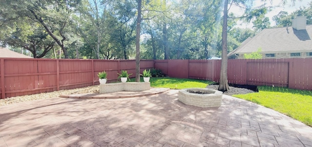 view of patio / terrace featuring an outdoor fire pit