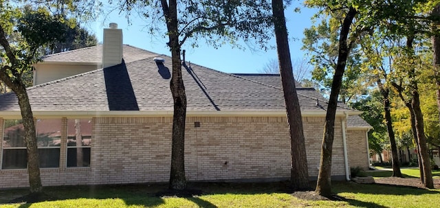 view of side of property featuring a yard