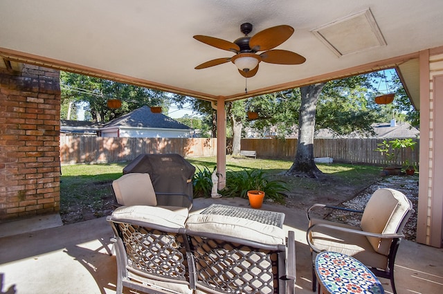 view of patio with area for grilling and ceiling fan