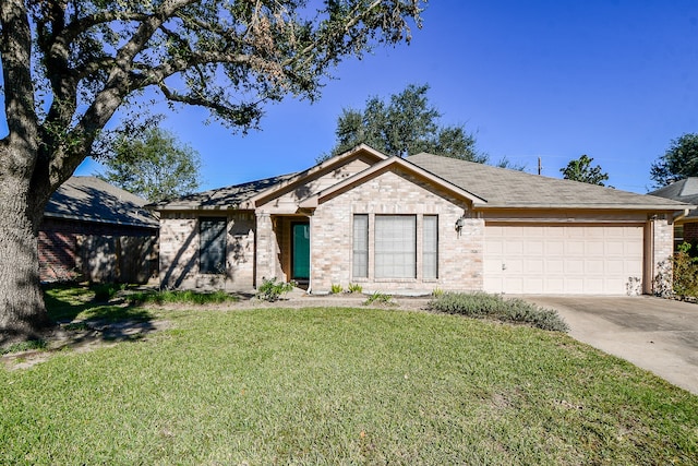 ranch-style house featuring a garage and a front lawn