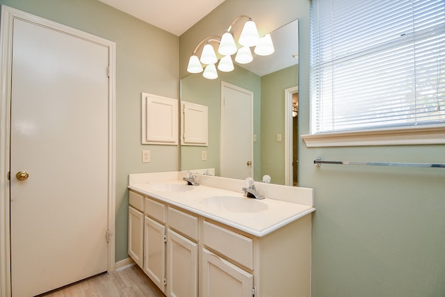 bathroom with wood-type flooring and vanity