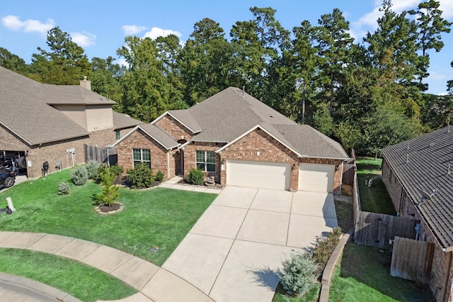 view of front of property featuring a garage and a front yard