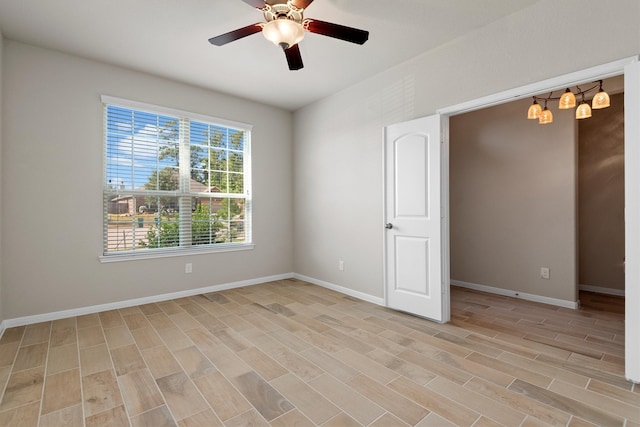 unfurnished room with ceiling fan and light hardwood / wood-style flooring