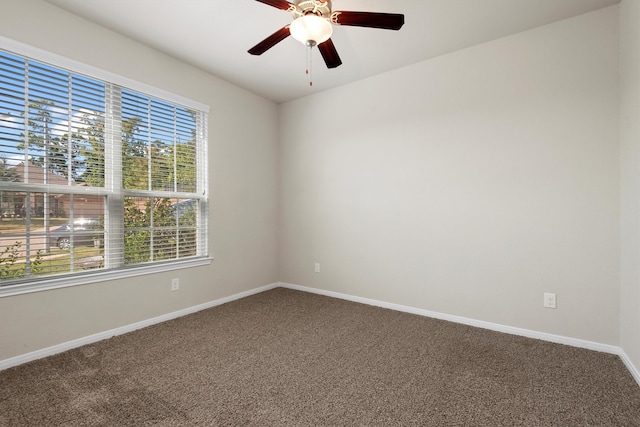 spare room with carpet and ceiling fan