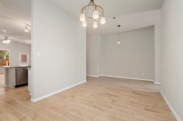 spare room with light hardwood / wood-style floors and ceiling fan with notable chandelier