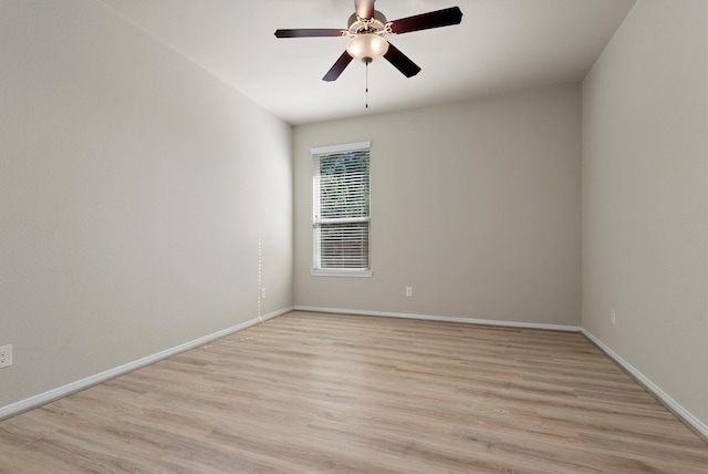 spare room featuring light hardwood / wood-style floors and ceiling fan