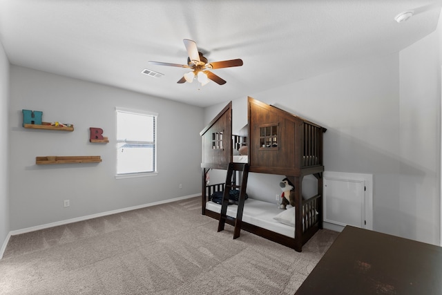 carpeted bedroom with ceiling fan